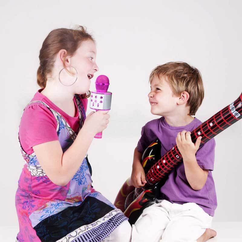 Child enjoying a kids' wireless Bluetooth karaoke microphone, perfect for home entertainment