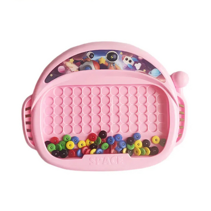 Beige magnetic drawing board with a pen, ideal for kids' artistic expression and early learning activities.