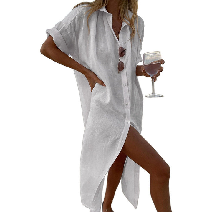 Stylish white oversized button-down beach shirt dress, a comfortable roll-sleeve cover-up for women's summer fashion.