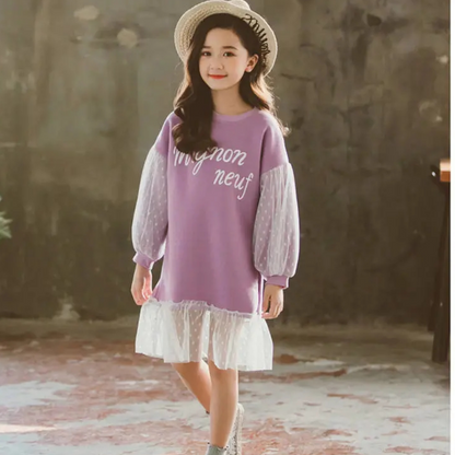 Toddler girl in a stylish pink polka dot lace knee-length dress, comfortable cotton for play