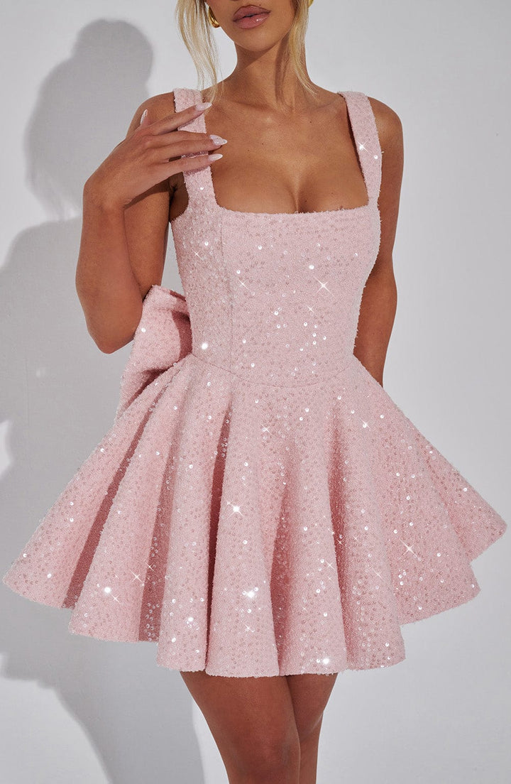 Chic white mini sequin dress with bow detail, a perfect homecoming or dance party outfit.