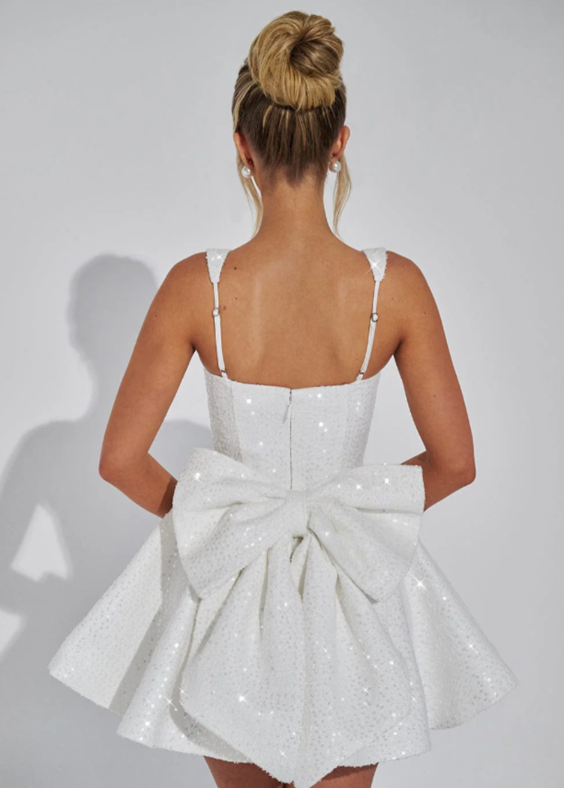 Glamorous women's pink sequin bow dress, skater style for homecoming & formal dance.
