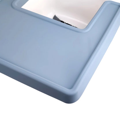 Foldable silicone baby placemat for high chairs, demonstrating portability. Easy transport for feeding.