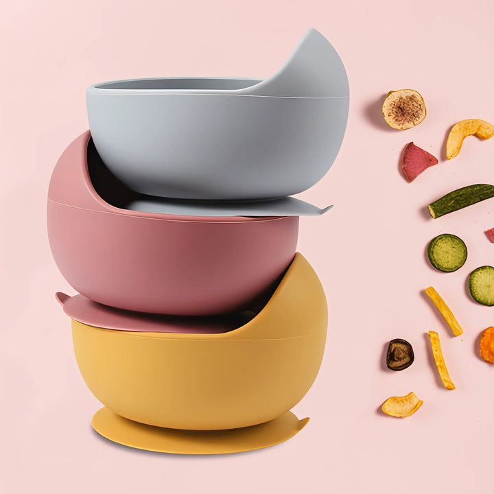 Pink silicone suction bowl, perfect for mess-free baby solid feeding and toddler meals.