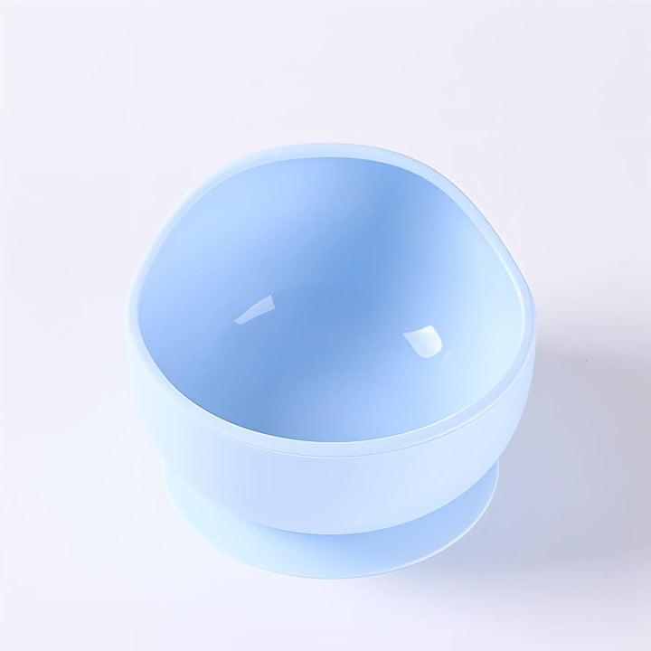 Stackable silicone suction bowls for space-saving baby and toddler meal storage solutions.
