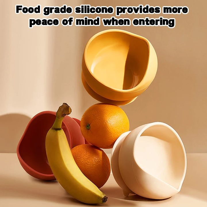 Bright red silicone suction bowl, making solid feeding fun and mess-free for infants.