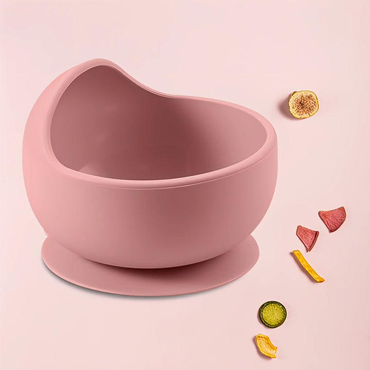 Toddler self-feeding with a blue BPA-free silicone suction bowl, making mealtime easy.