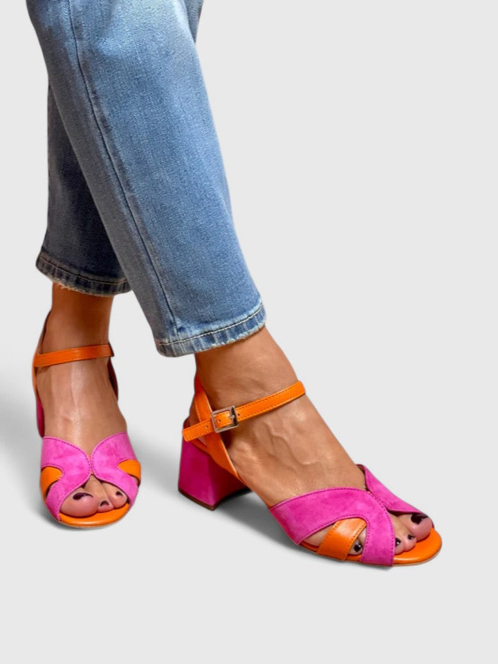 Comfortable pink wedge heel sandals for women, featuring an adjustable strap & open-toe design, ideal for summer fashion.