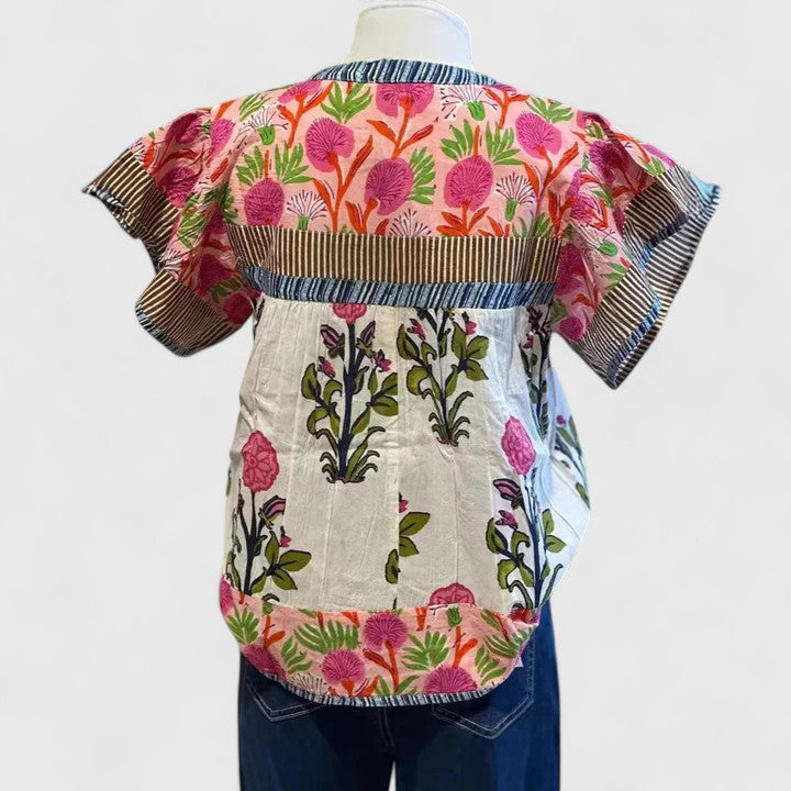 Comfortable pink women's blouse featuring intricate embroidery, ideal for versatile casual spring & summer fashion.