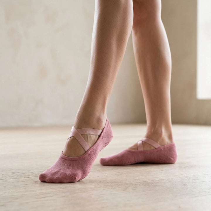 Pink women's non-slip low-cut studio socks for yoga & pilates. Grip activewear for enhanced stability in workouts.