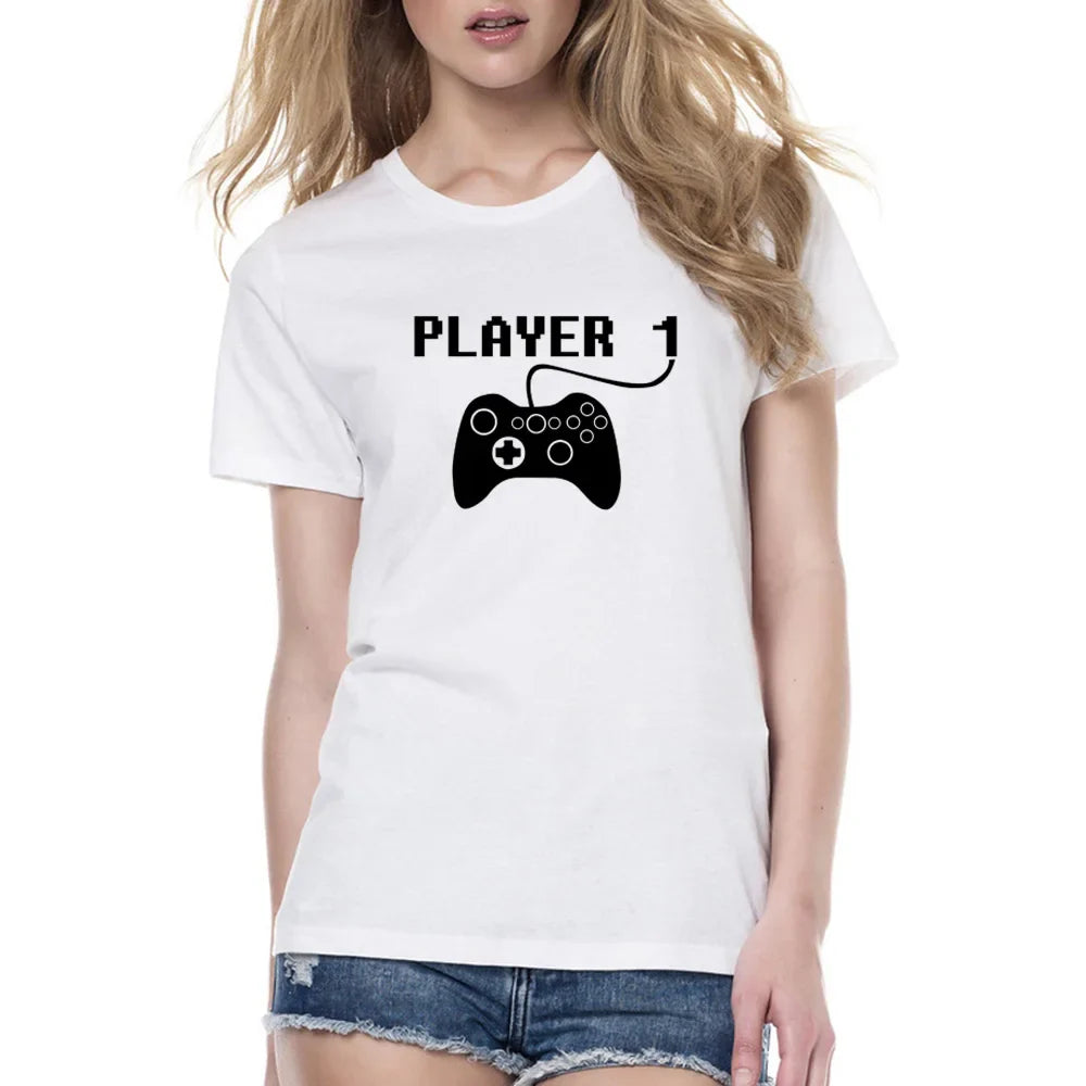 Matching 'Player 1' adult t-shirt and 'Player 2' kids apparel, gamer family outfit.