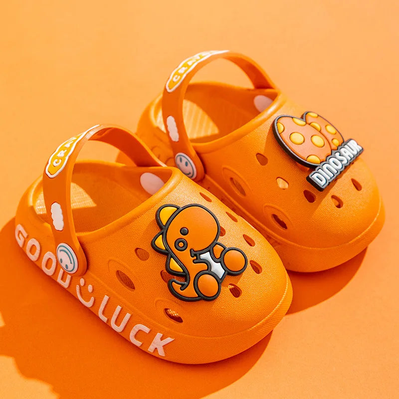 Boy's feet in blue cartoon non-slip sandals, ideal summer shoes for outdoor adventures