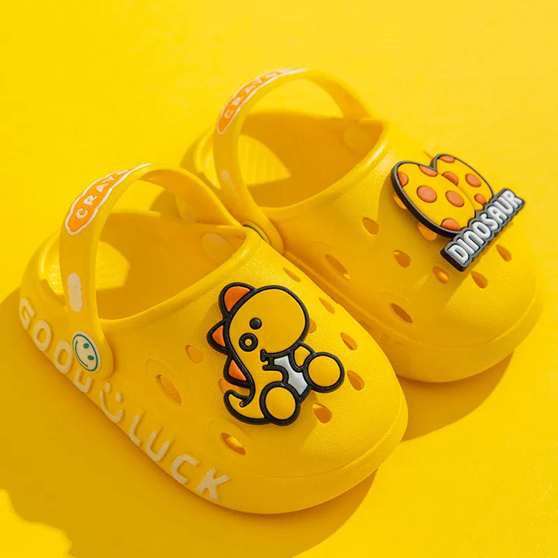 Yellow cartoon toddlers sandals on a beach, non-slip play shoes for summer fun