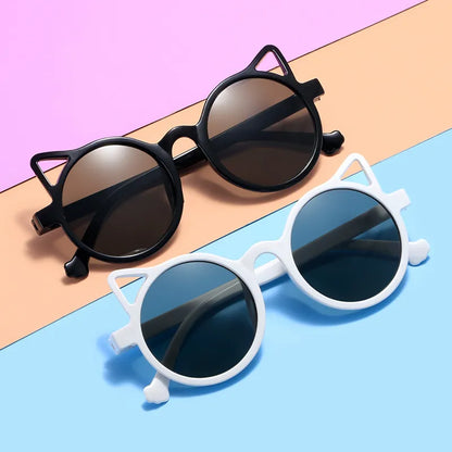 Playful pink cat-eye sunglasses for kids, offering UV400 protection.