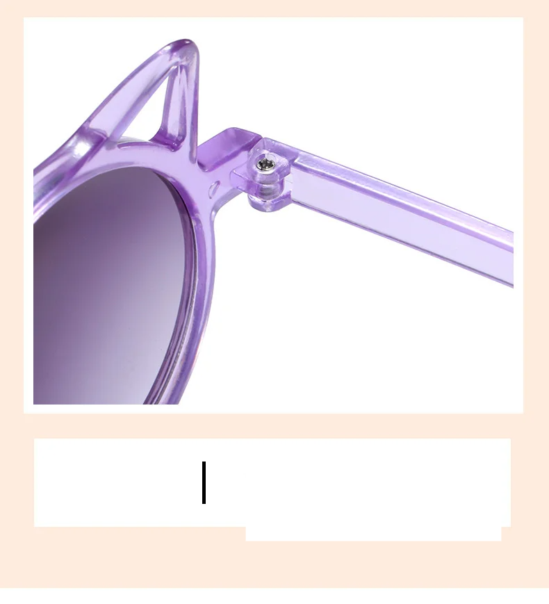 Child smiling while wearing trendy cat-eye sunglasses, ensuring UV protection for delicate eyes.