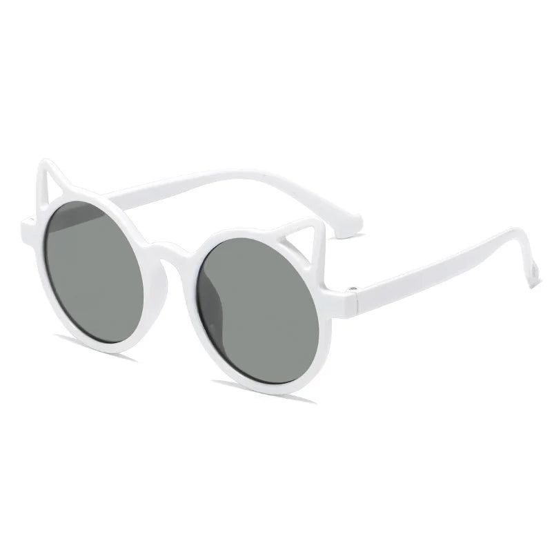 Detail shot of the durable frame and lenses of kids cat-eye UV protection sunglasses.