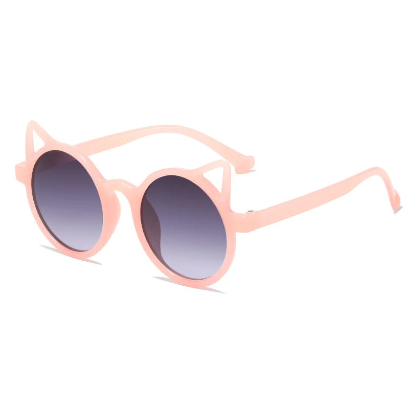 Range of colorful cat-eye sunglasses for kids, displayed as fashionable eyewear.