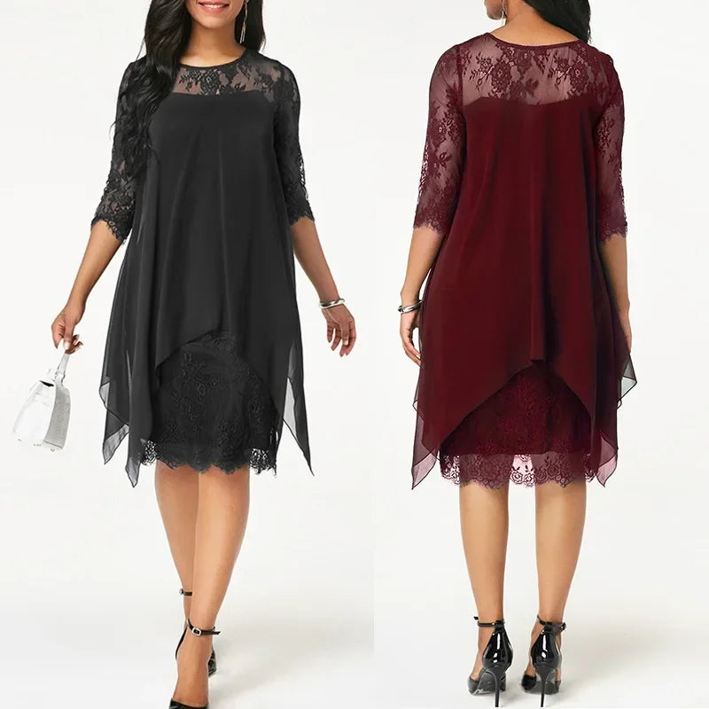 Feminine plus size cocktail dress, quarter sleeve & flattering asymmetrical hem. Ideal for evening events.
