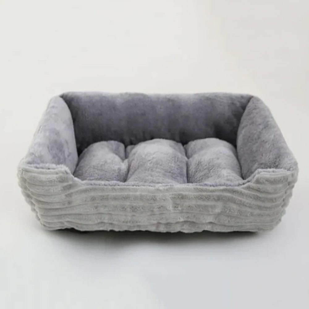 Plush dog bed with ultra-soft fabric, providing optimal pet comfort and cozy sleep. Washable & non-slip.