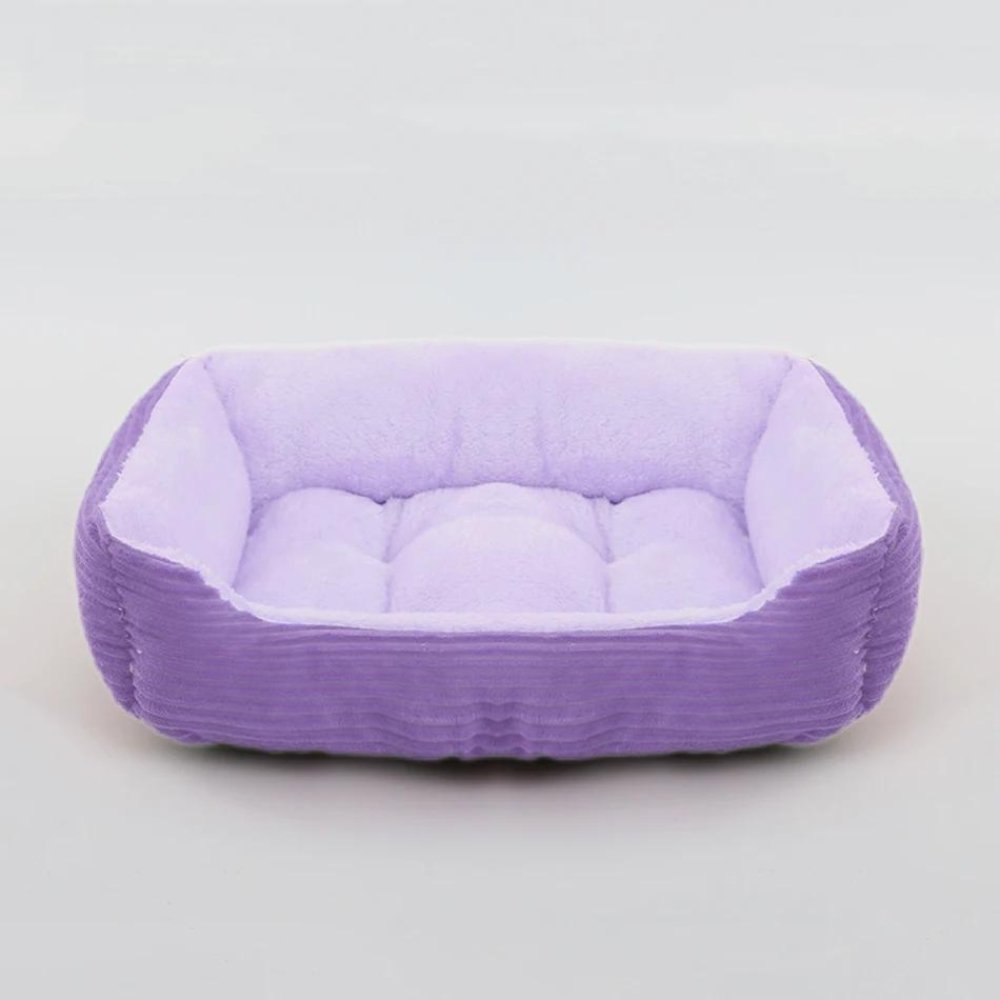 Durable plush pet bed with a non-slip base, ensuring long-lasting comfort and stability for active pets.