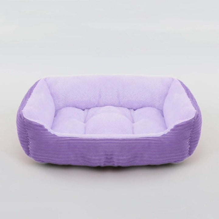 Durable plush pet bed with a non-slip base, ensuring long-lasting comfort and stability for active pets.