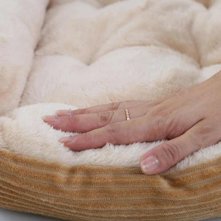 Soft plush dog bed designed for ultimate pet comfort and restful sleep. Easy-care washable material.
