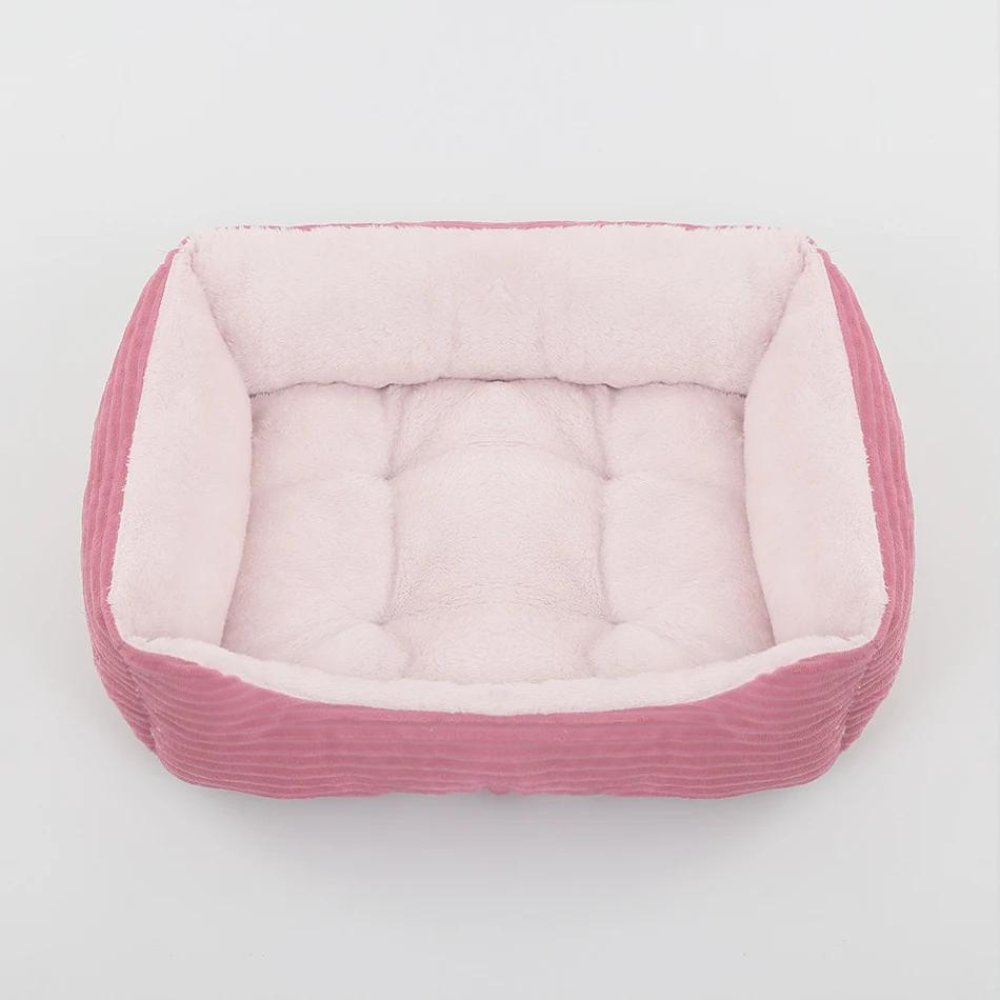 Deluxe plush dog bed offering superior comfort and support for pets. Features a cozy, washable design.