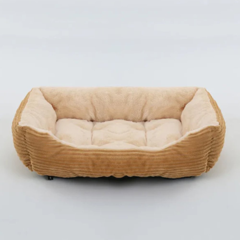 Cozy plush dog bed, ideal for deep, comfortable sleep. A snug haven for your furry friend.