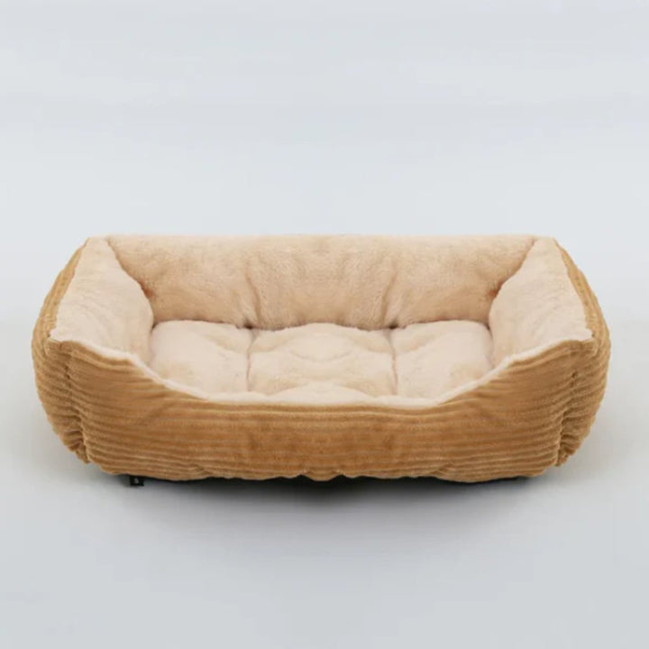 Cozy plush dog bed, ideal for deep, comfortable sleep. A snug haven for your furry friend.