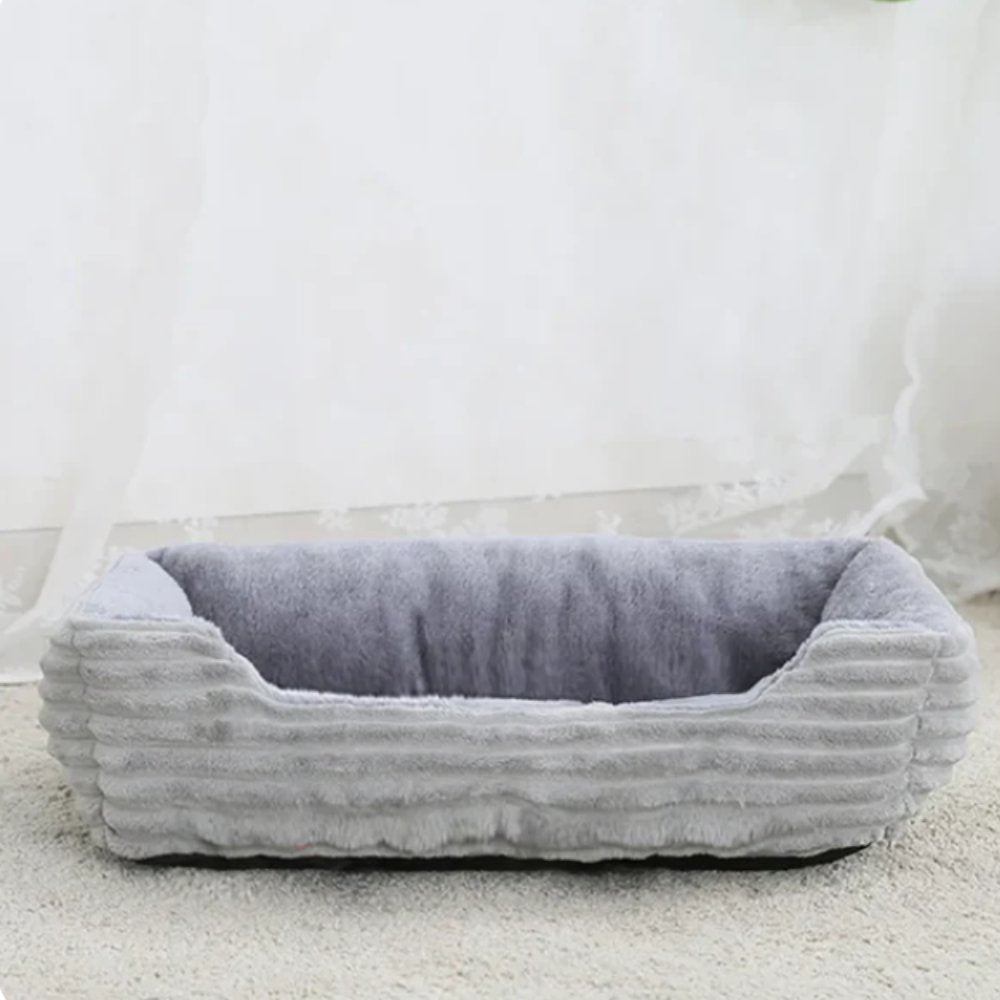 Washable plush pet bed for hassle-free cleaning. Provides a hygienic and comfortable sleeping space.