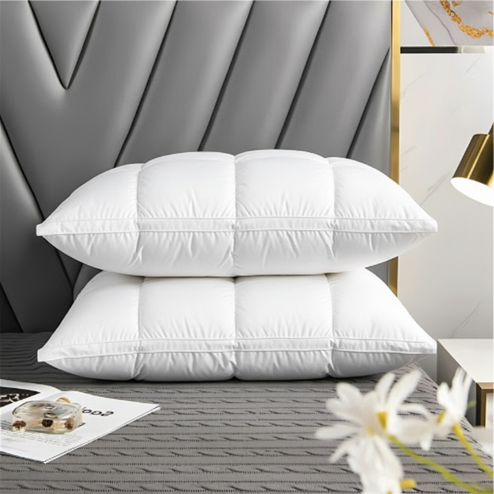 Luxurious plush down alternative pillow on a bed, offering balanced support for serene bedroom sleep.