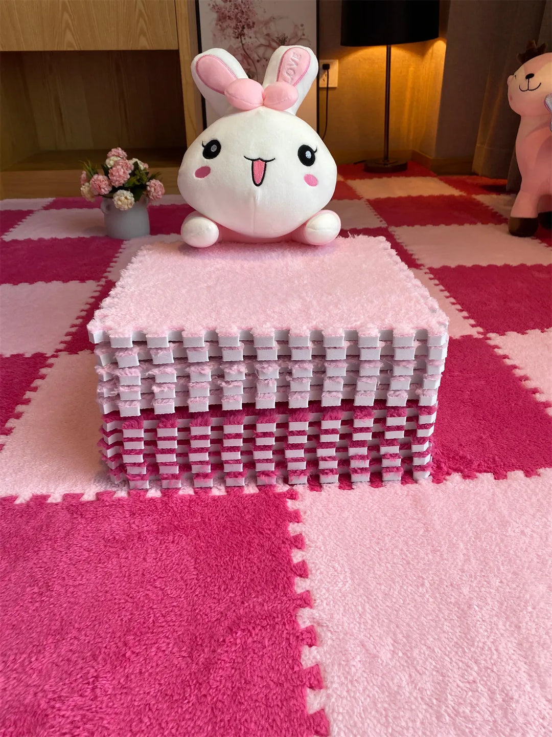Plush foam crawling tiles, protecting baby from hard floors in the nursery.