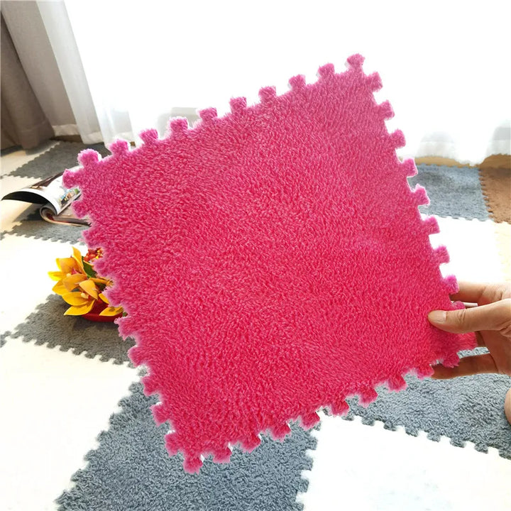 Velvety soft plush foam playmat tiles, creating a safe, comfortable surface for baby's nursery.