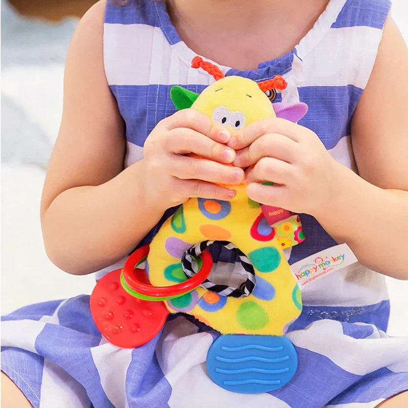 Handheld giraffe plush rattle and teether, ideal for newborn sensory play.
