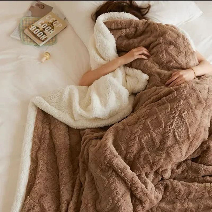 Plush lambswool blanket for ultimate warmth. Soft microfiber flannel throw for cozy winter nights & bedroom decor.