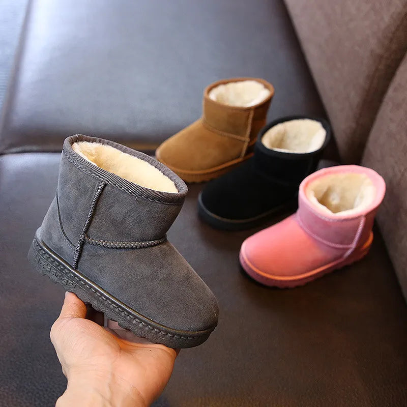 Pink children's winter boots with a soft cotton lining, ideal for snow and cold weather warmth.