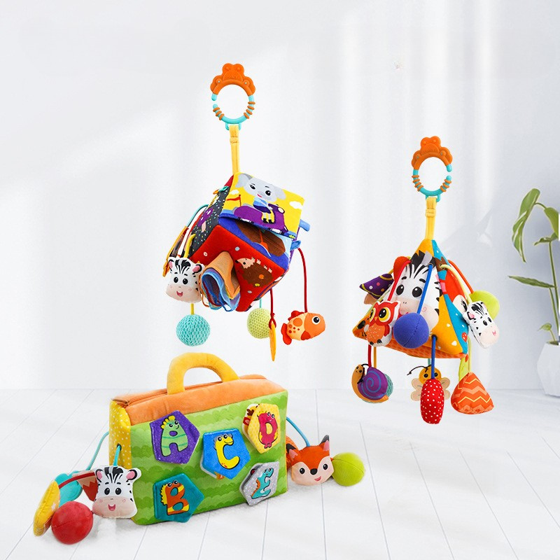 Plush lion clip-on baby sensory toy for stroller or crib, featuring crinkle sounds and colorful tags