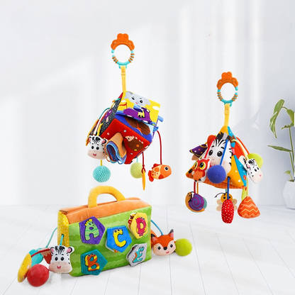 Plush lion clip-on baby sensory toy for stroller or crib, featuring crinkle sounds and colorful tags