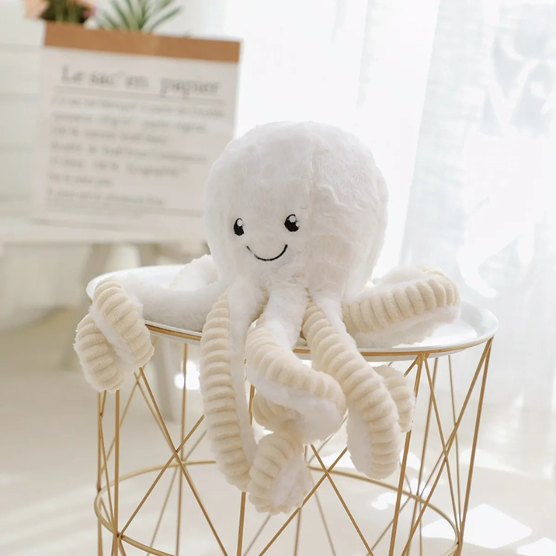 Plush octopus comfort toy for baby, in soft grey, with soothing textures, sleep aid