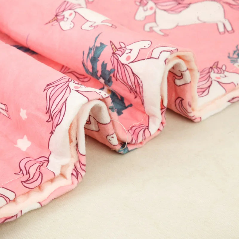 Teal baby swaddle blanket with playful elephant prints, soft fleece, a delightful baby gift idea