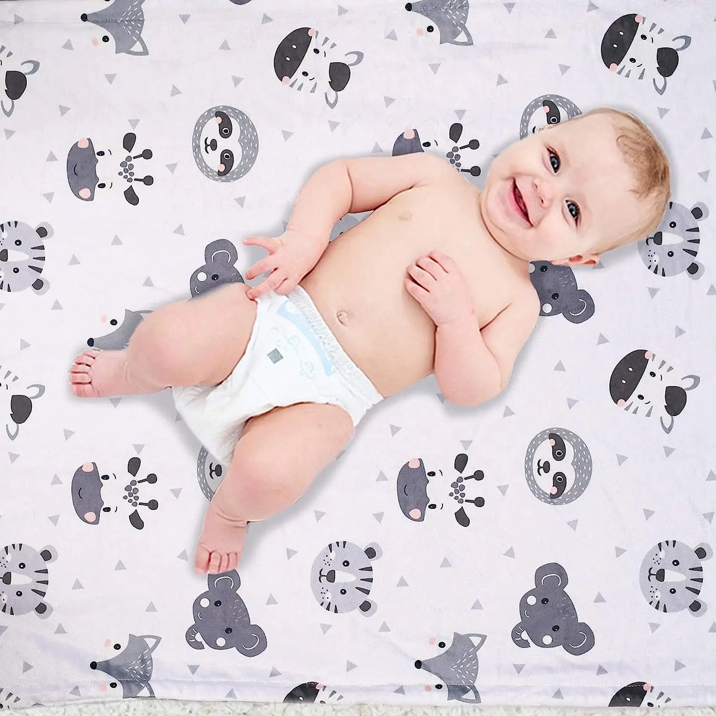 Grey newborn swaddle blanket with whimsical moon and cloud patterns, cozy sleep aid for infants