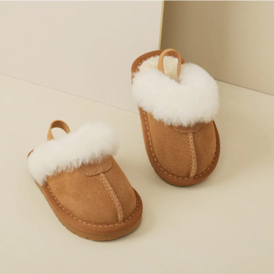 Plush pink toddler slippers with non-slip sole, perfect for warm winter indoor play.