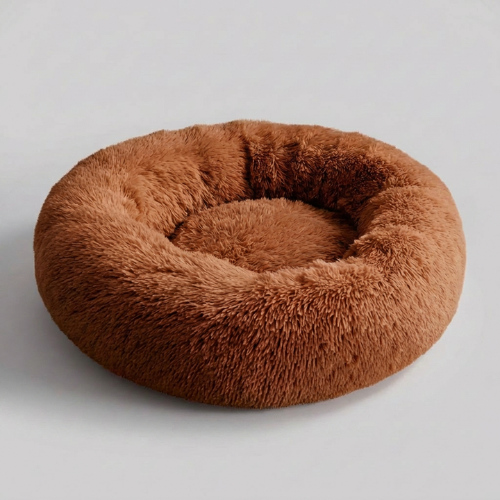 Soft, machine washable pet bed for dogs. Plush faux fur anti-anxiety dog bed offers cozy comfort and easy care.