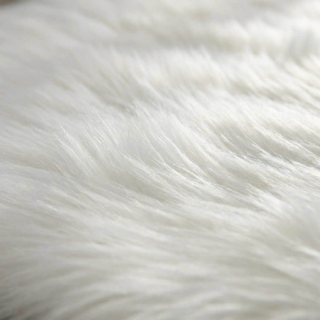 Luxurious faux fur bench runner rug with a deep shag pile and stylish wave pattern. Perfect soft rug for bedroom.
