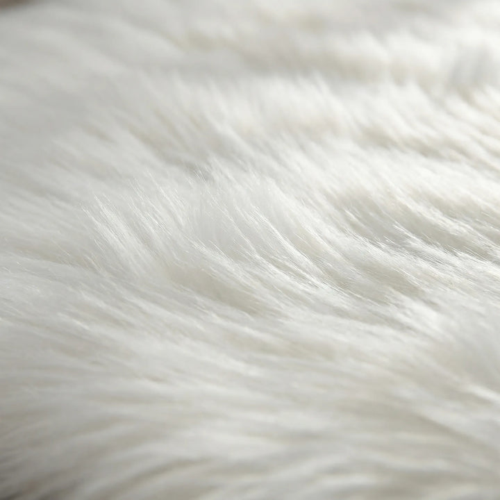 Luxurious faux fur bench runner rug with a deep shag pile and stylish wave pattern. Perfect soft rug for bedroom.