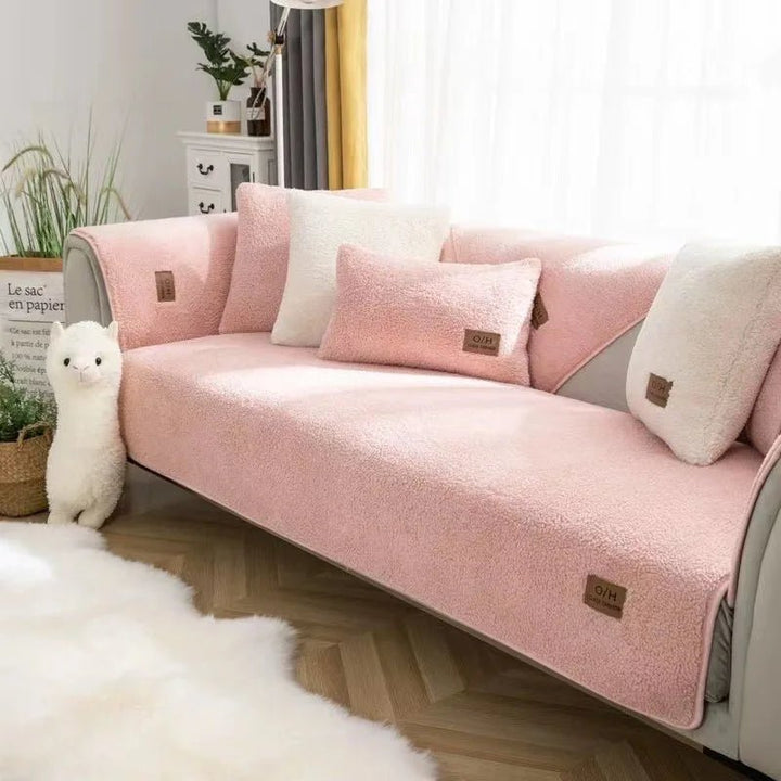 Machine washable plush polyester sofa cover; durable protection for everyday use.