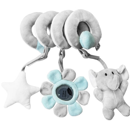 Spiral developmental toy wrapped around a crib rail, offering sensory fun for baby