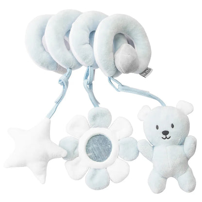 Baby's hand grasping a plush animal from the spiral activity toy, promoting motor skills
