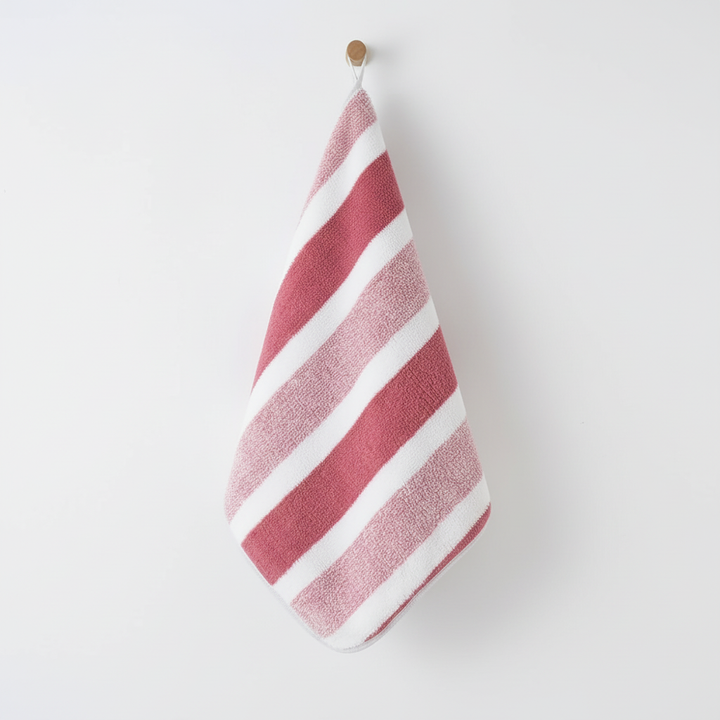 Soft coral fleece striped microfiber towel set. Absorbent, quick-dry bath and hand towels for modern bathrooms.