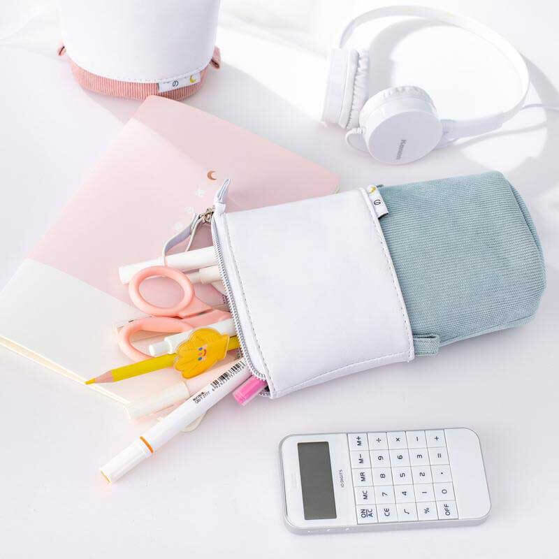 Artist's pastel pop-up pencil case, keeps art supplies organized and easily accessible.